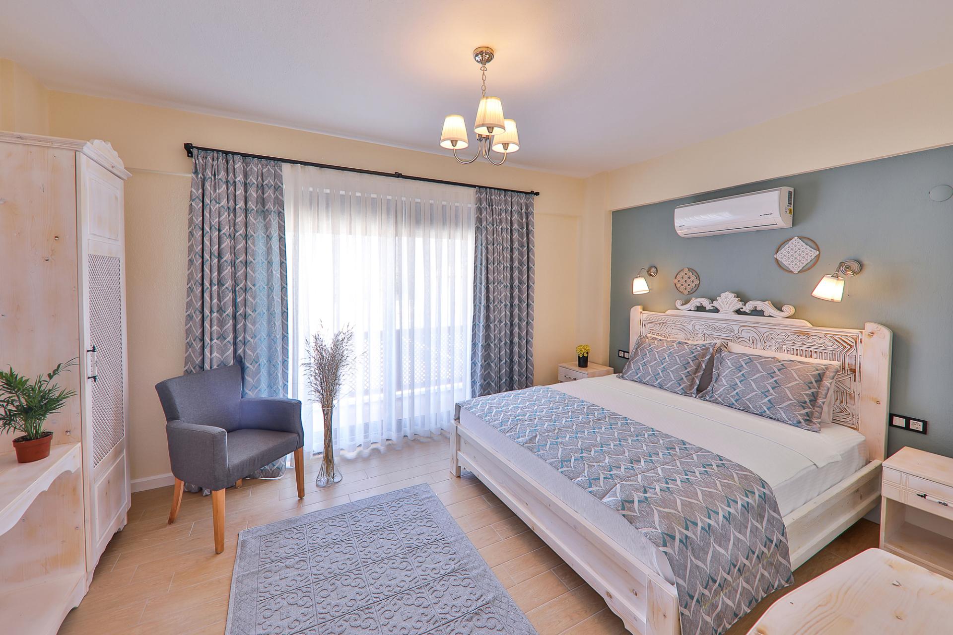 Relax and unwind in our cozy bedroom with a comfortable double bed.