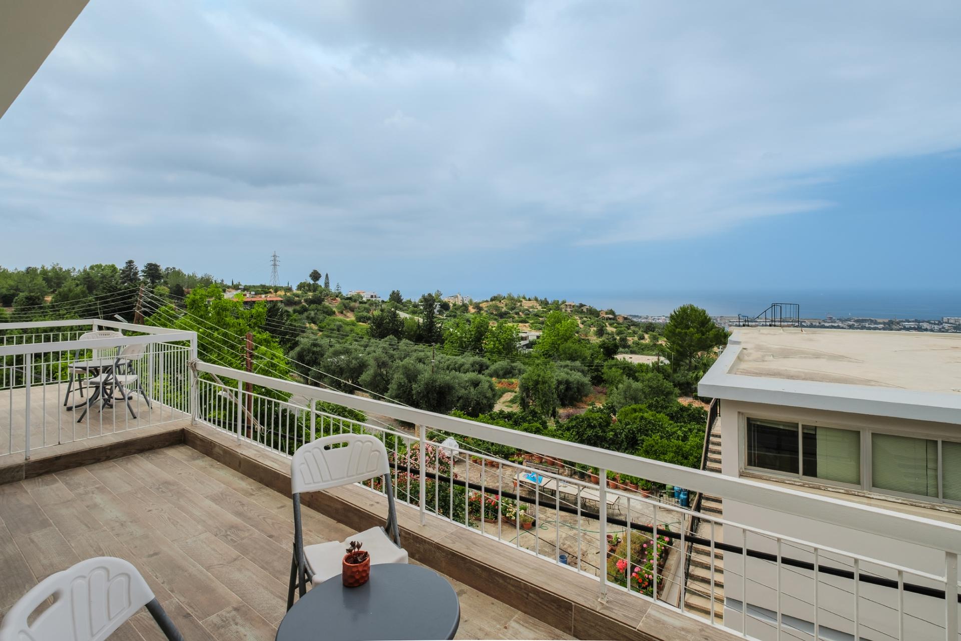 Enjoy the fresh air and panoramic vistas from our house's expansive terrace.