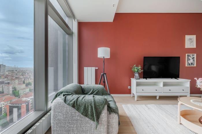 Stylish living room adorned with contemporary art and sleek furniture.