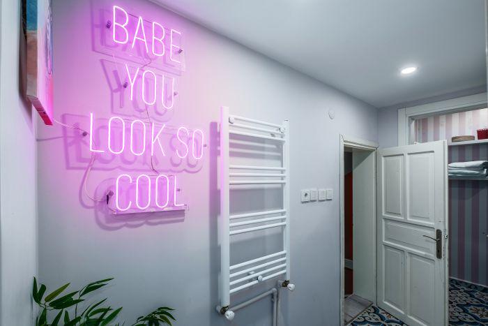 Brighten up in style! This chic corner radiates positivity with its neon glow and modern design