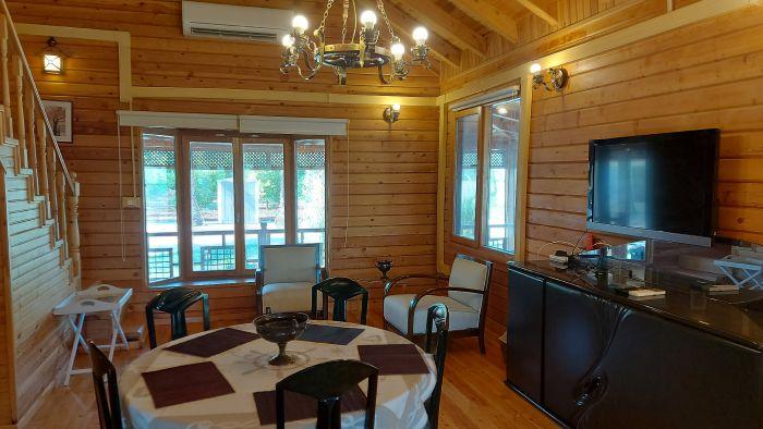 Cozy living area with dining space and outdoor access.