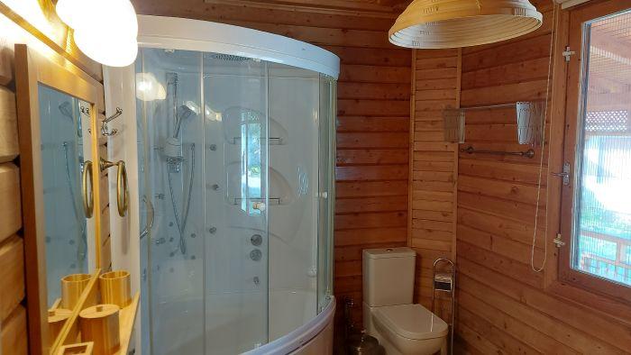 Relax and refresh in the well-appointed bathroom featuring a modern shower and ample space.