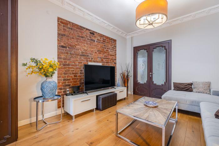 A welcoming living room featuring an expansive bay window that floods the room with sunlight.