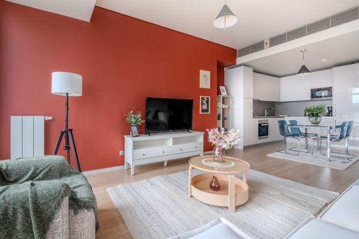 A welcoming living room featuring an expansive bay window that floods the room with sunlight.